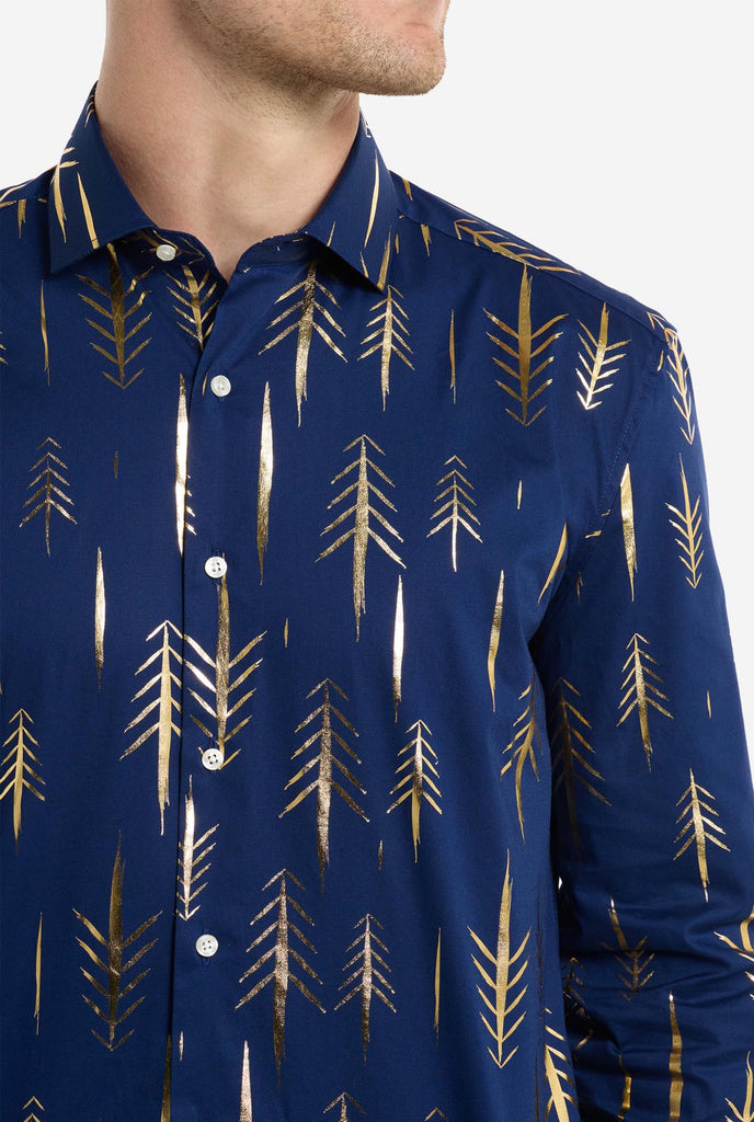 Man wearing dark blue Christmas shirt with golden foil trees, close up