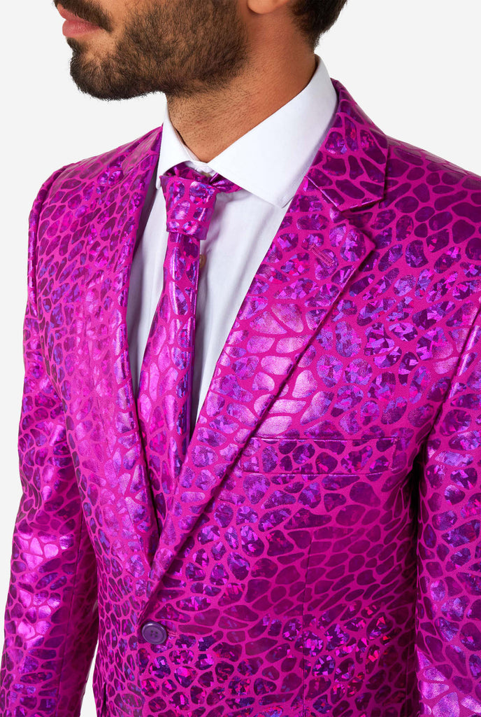 Man wearing shiny pink lizard skin men's suit, close up