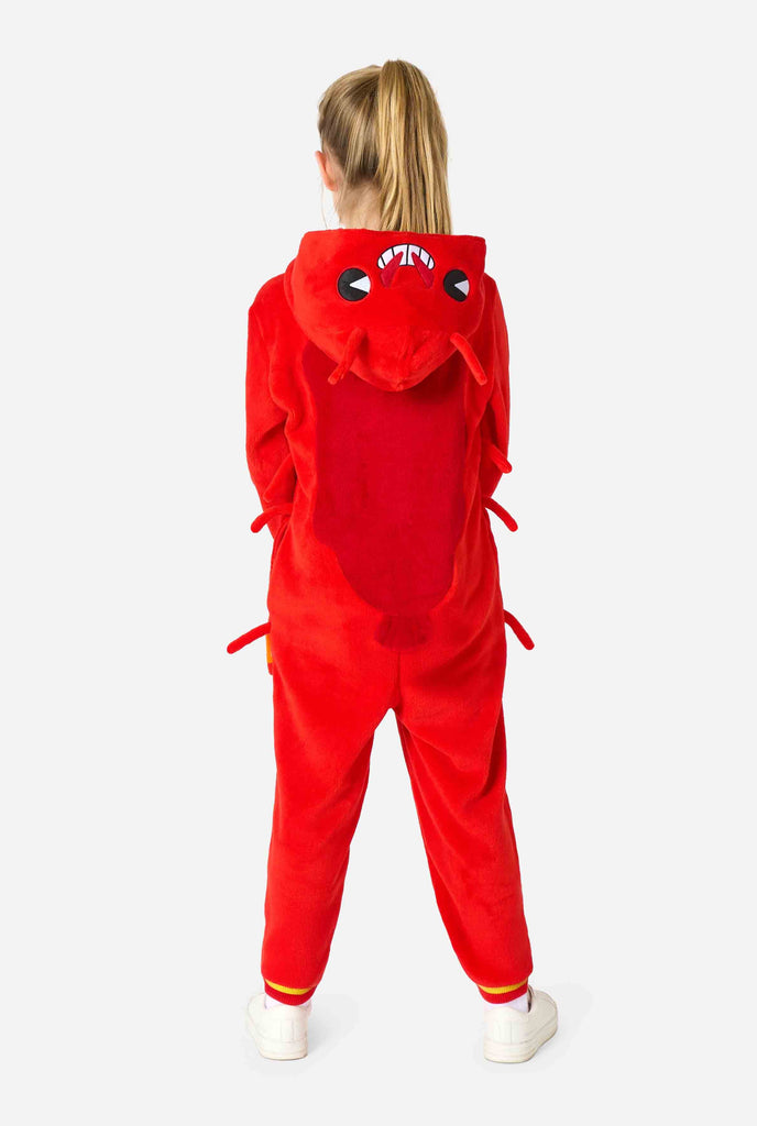 A kid is wearing a bright red lobster-themed kids onesie featuring playful hood details and cozy, soft material. View from the back.